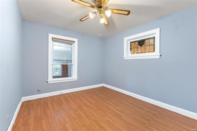 spare room featuring ceiling fan and light wood-type flooring