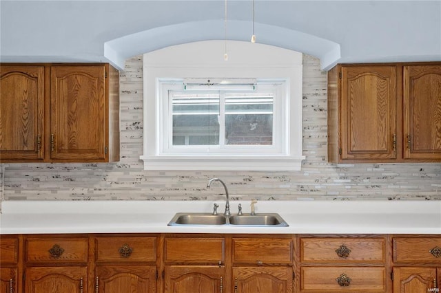 kitchen with sink and decorative backsplash