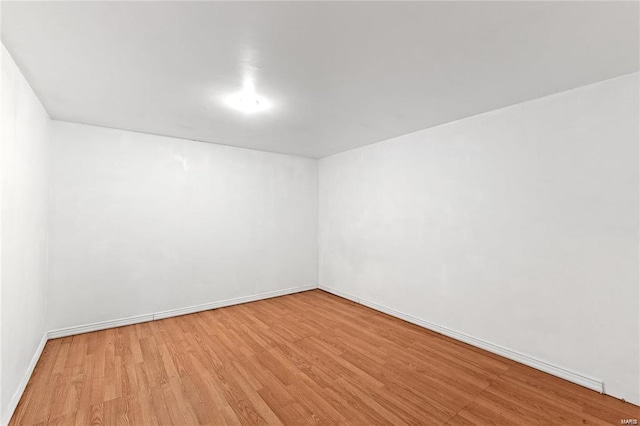 unfurnished room featuring light hardwood / wood-style floors