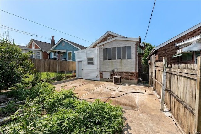 rear view of property featuring a patio area