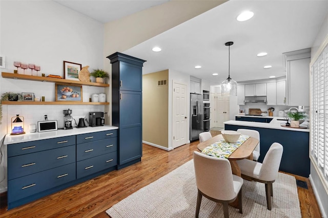 dining room with light hardwood / wood-style floors