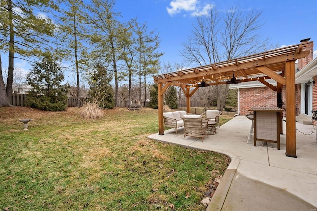 view of yard featuring a pergola, an outdoor hangout area, and a patio area