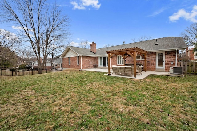 back of house with a patio area, a yard, a pergola, and central AC