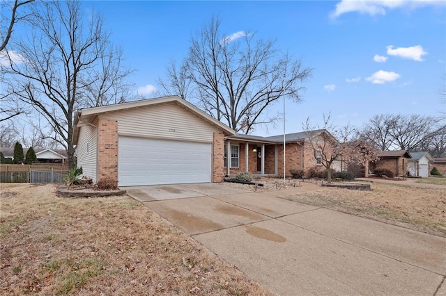 ranch-style house with a garage and a front yard