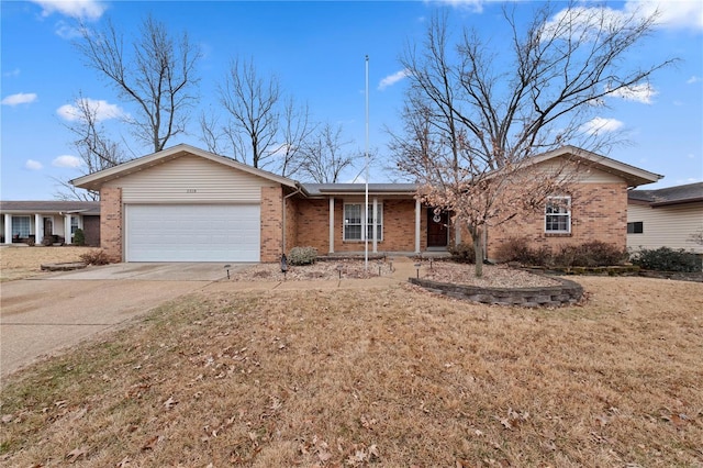 single story home featuring a garage and a front lawn