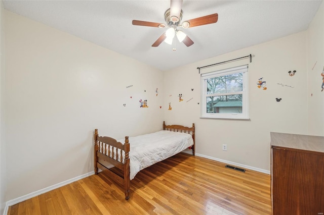 bedroom featuring light hardwood / wood-style floors and ceiling fan