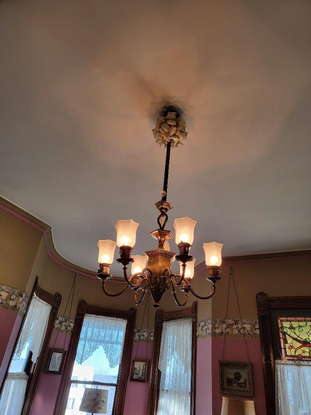 details with an inviting chandelier