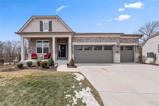 view of front of home featuring a porch, a garage, brick siding, concrete driveway, and board and batten siding