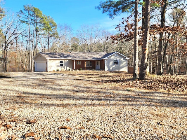 ranch-style house featuring a garage