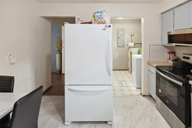 kitchen featuring washer / clothes dryer, appliances with stainless steel finishes, light countertops, electric panel, and marble finish floor