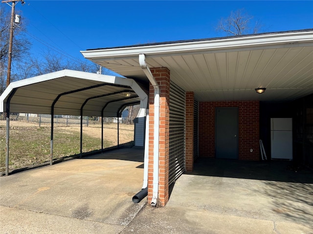 view of vehicle parking with a carport