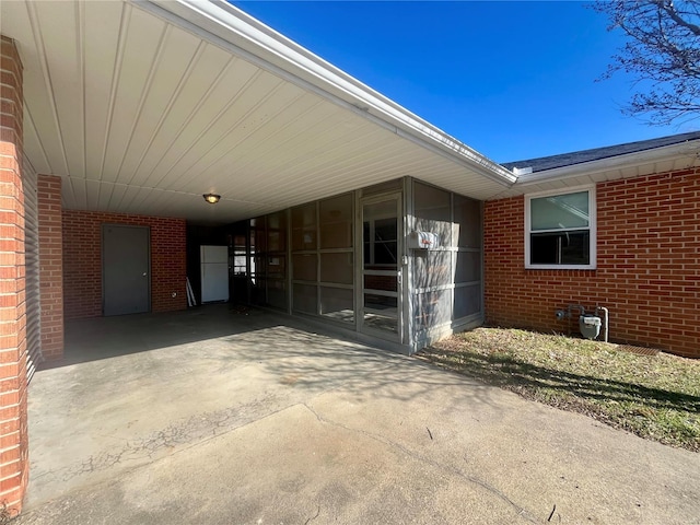 property entrance featuring a carport