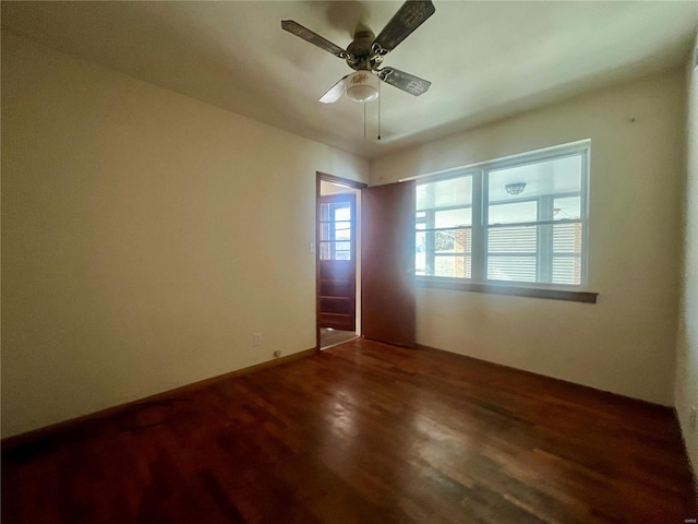 spare room with wood-type flooring and ceiling fan