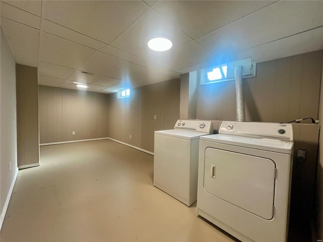 clothes washing area with washer and clothes dryer