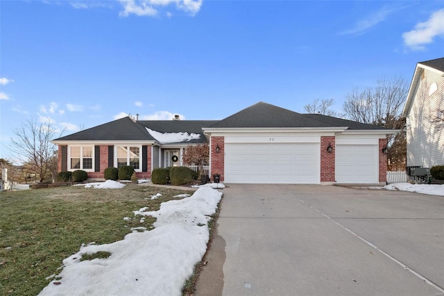 single story home with a garage and a front yard