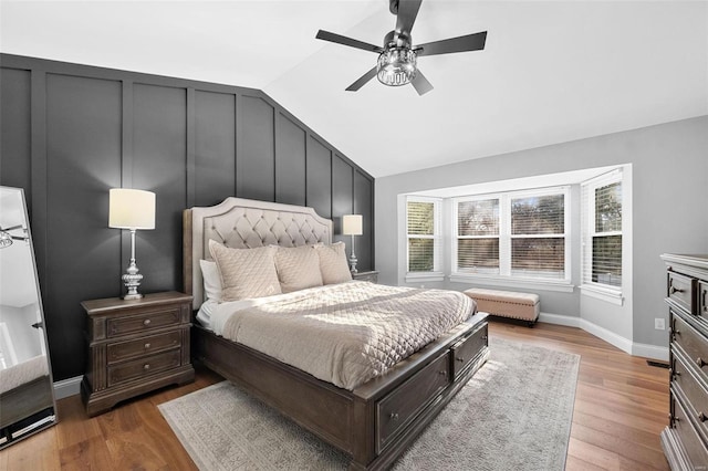 bedroom featuring lofted ceiling, hardwood / wood-style floors, and ceiling fan