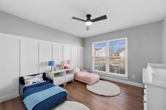 bedroom featuring ceiling fan and dark hardwood / wood-style floors