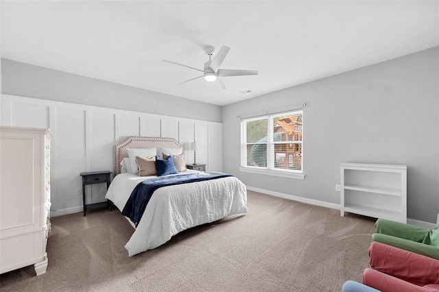 bedroom with dark colored carpet and ceiling fan