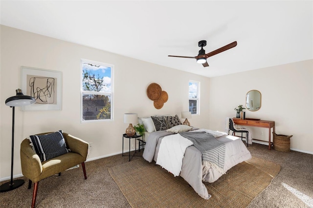 bedroom with ceiling fan and dark carpet