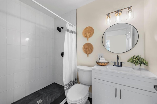 bathroom featuring vanity, toilet, and walk in shower