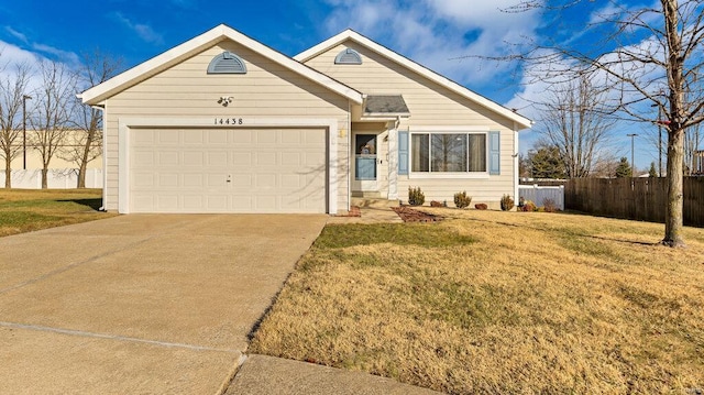 view of front facade featuring a garage and a front lawn