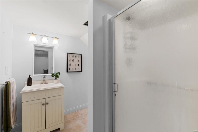 bathroom featuring vanity, an enclosed shower, and tile patterned floors