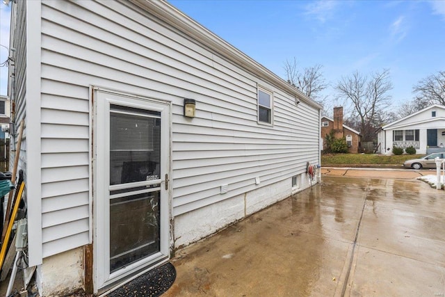 view of property exterior with a patio