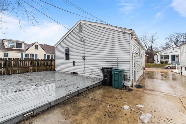 view of property exterior with a wooden deck