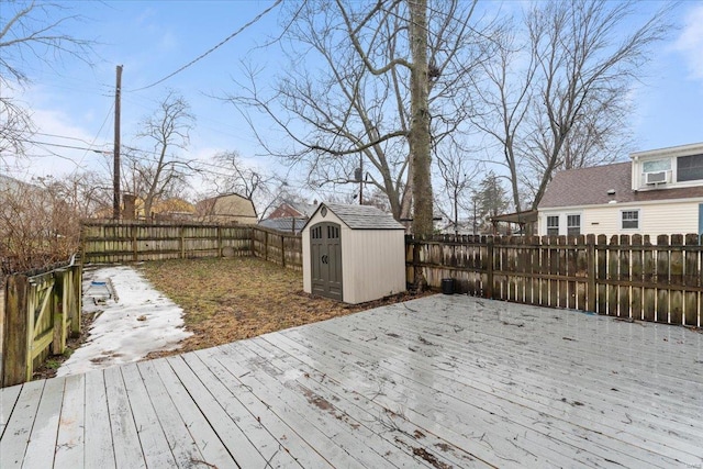 wooden deck with a storage shed