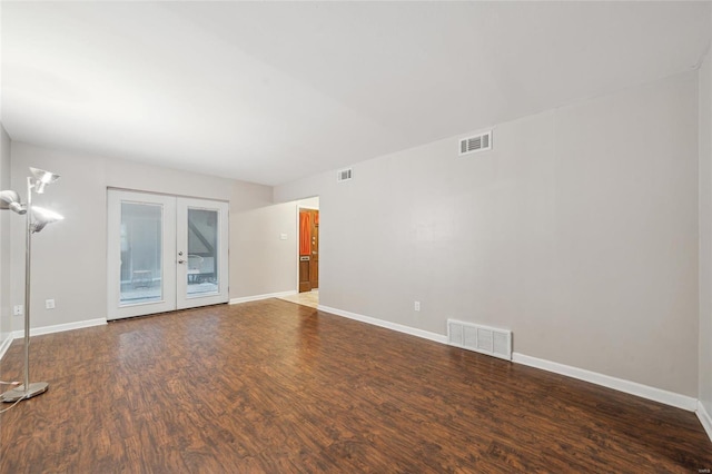 unfurnished room featuring dark wood-type flooring and french doors