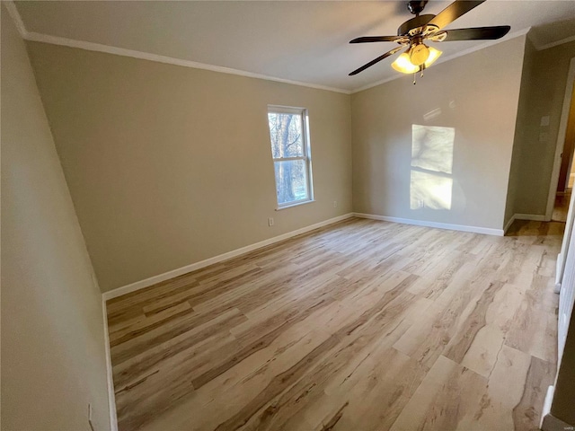 unfurnished room featuring crown molding, light wood-style floors, baseboards, and ceiling fan