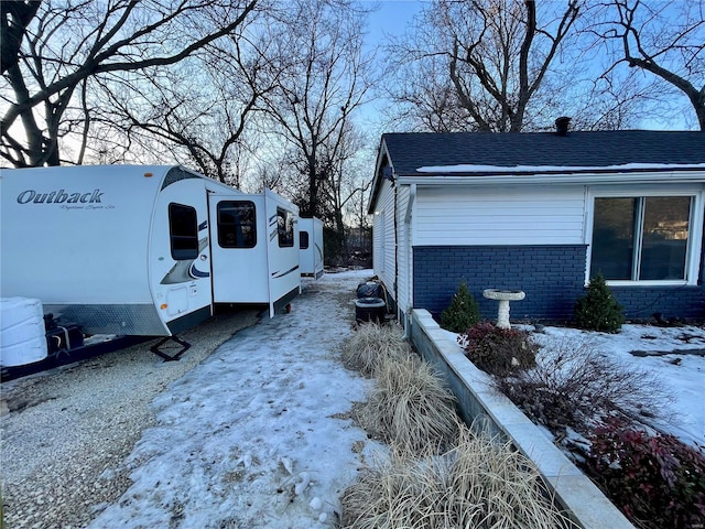 view of snow covered property