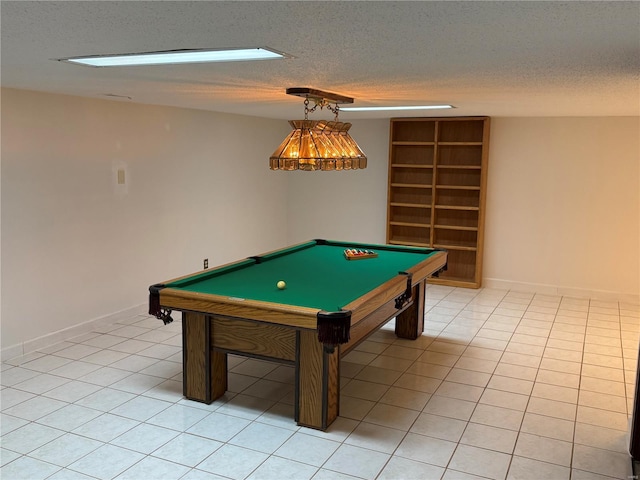 rec room featuring billiards, a textured ceiling, and light tile patterned flooring