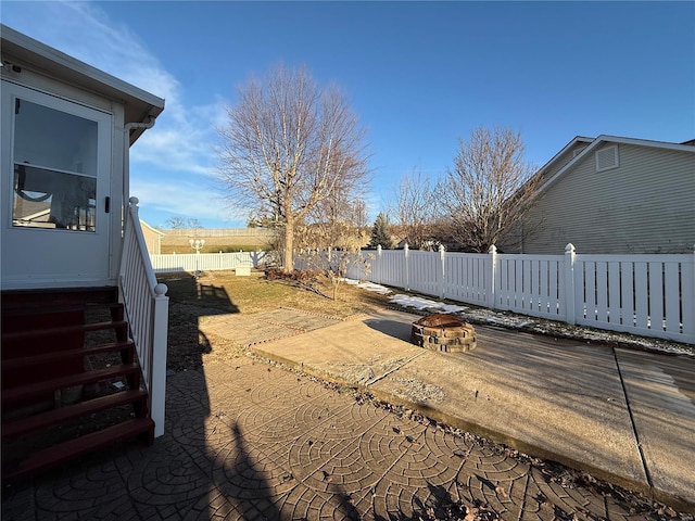 view of yard with a fire pit