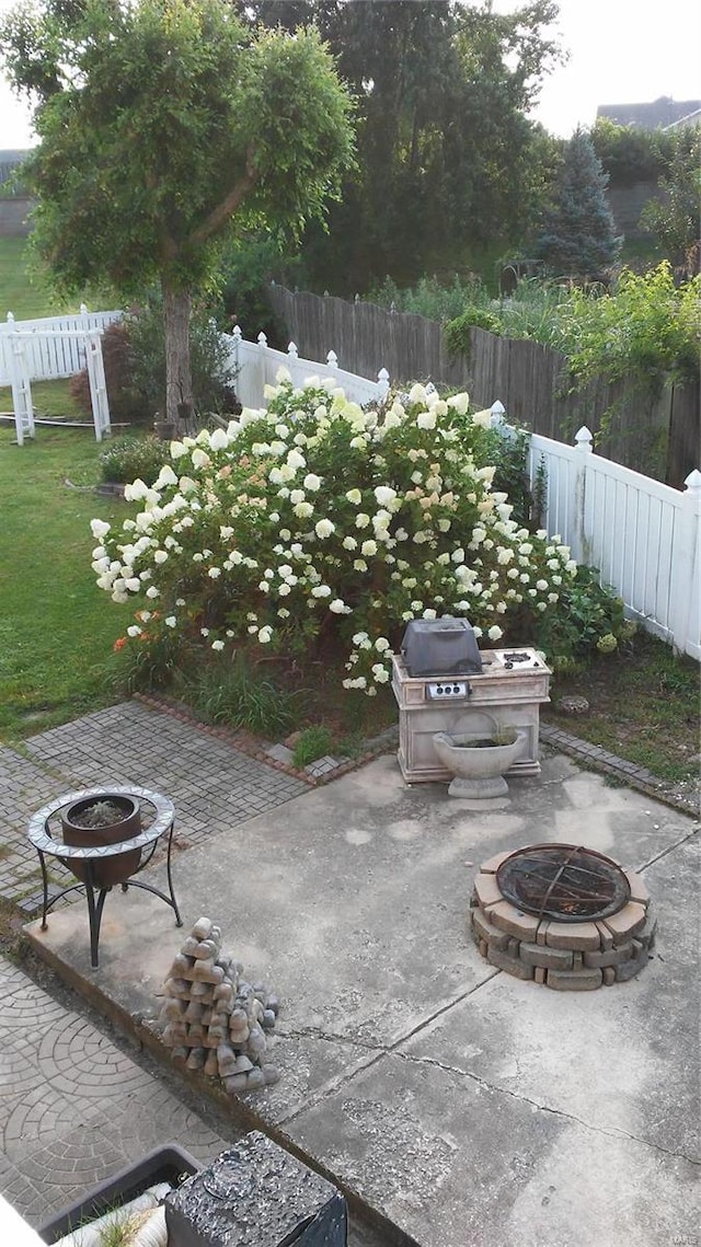 view of patio / terrace with a fire pit