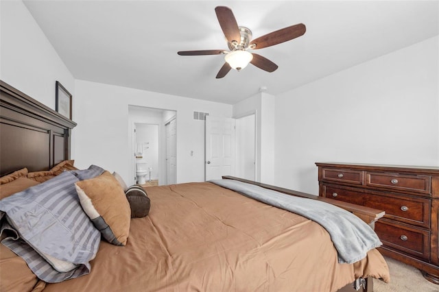 carpeted bedroom featuring connected bathroom and ceiling fan