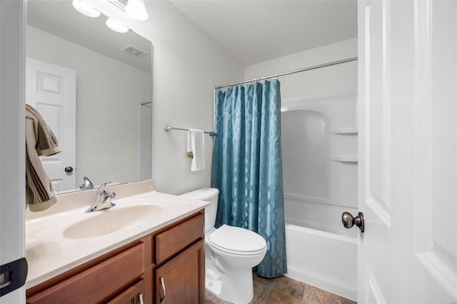 full bathroom featuring vanity, shower / tub combo, and toilet