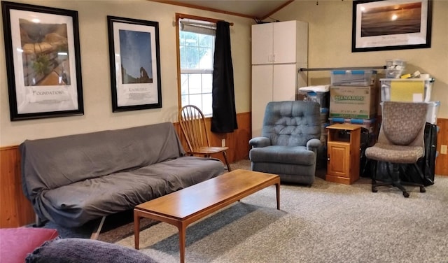 sitting room with light carpet, wooden walls, and vaulted ceiling