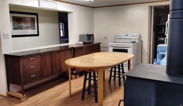 kitchen featuring ornamental molding, white electric range, dark brown cabinets, and light hardwood / wood-style floors