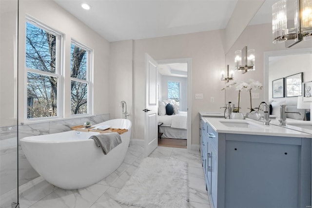 bathroom with vanity and a bathtub