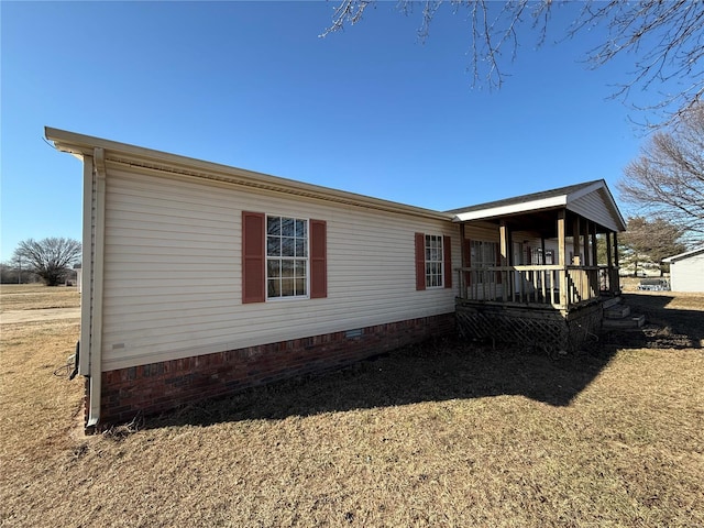 view of property exterior featuring covered porch