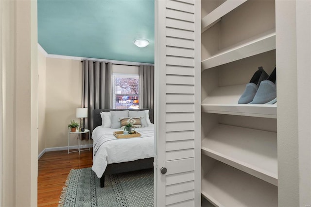 bedroom featuring wood-type flooring