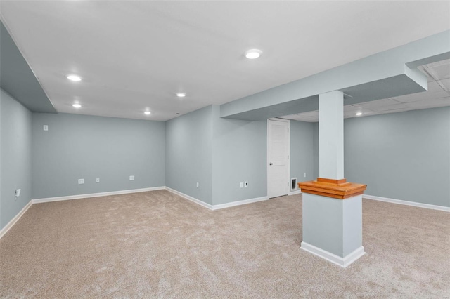 basement with light colored carpet