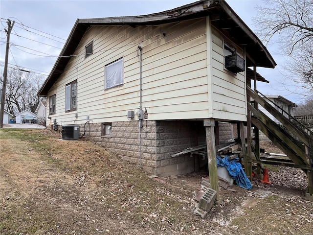 view of property exterior featuring central AC