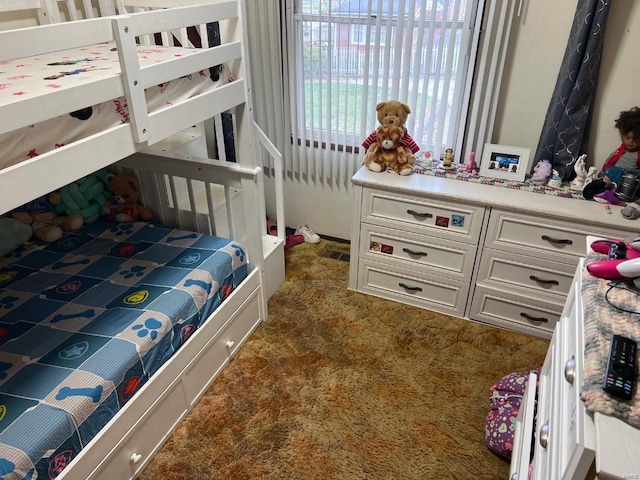 bedroom featuring dark colored carpet