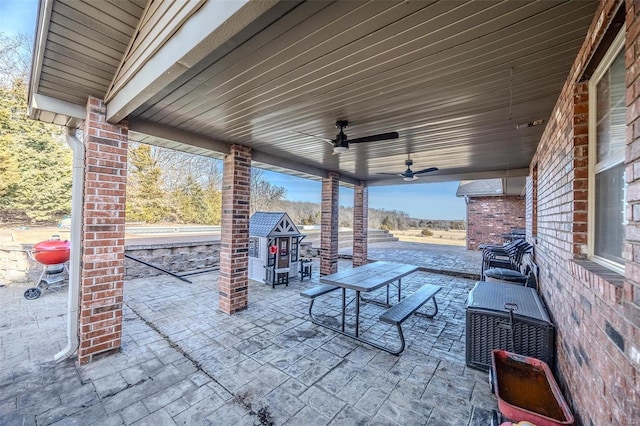 view of patio featuring ceiling fan