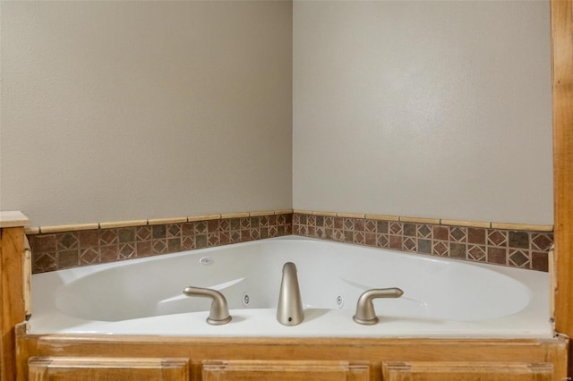 bathroom with tiled bath