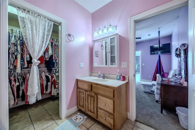 bathroom with tile patterned floors and vanity