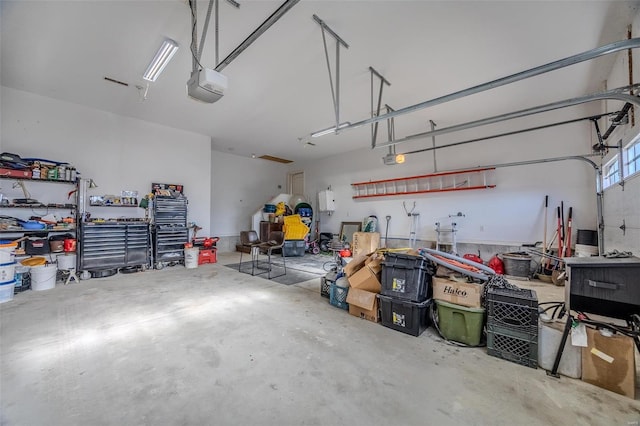 garage featuring a garage door opener and a workshop area