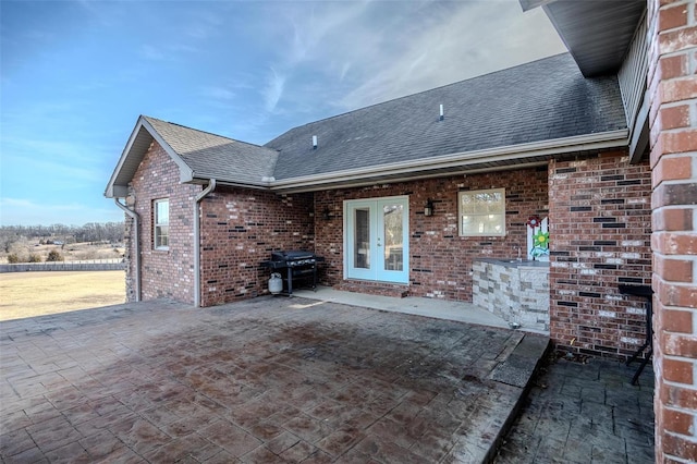 exterior space with area for grilling and french doors